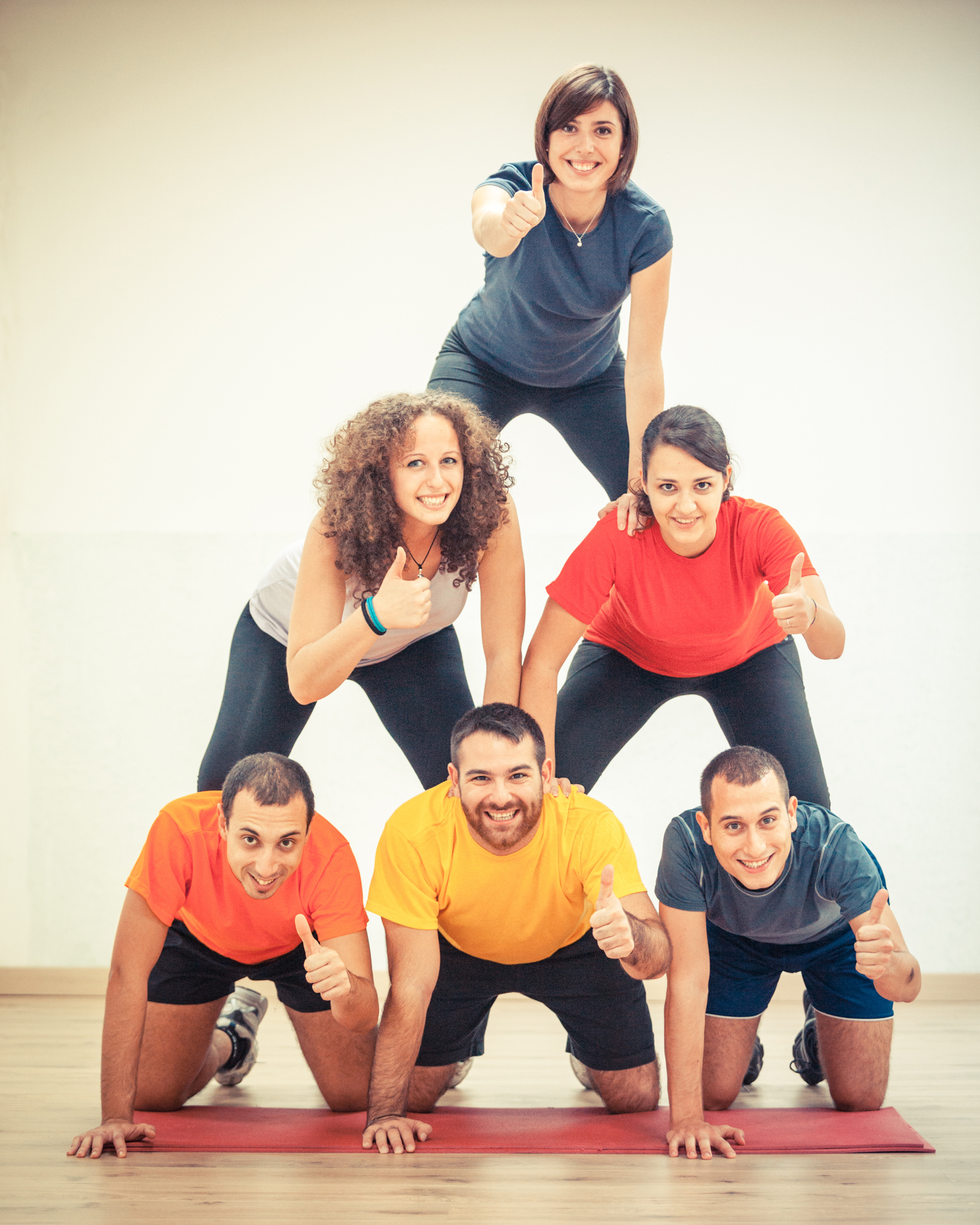 people making a pyramid