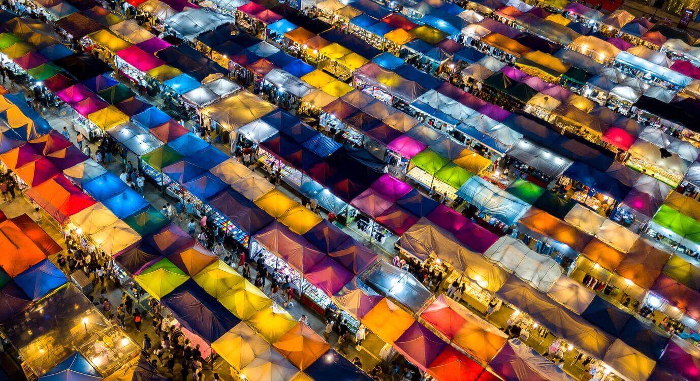 Photo from above of a classic marketplace with tents everywhere.