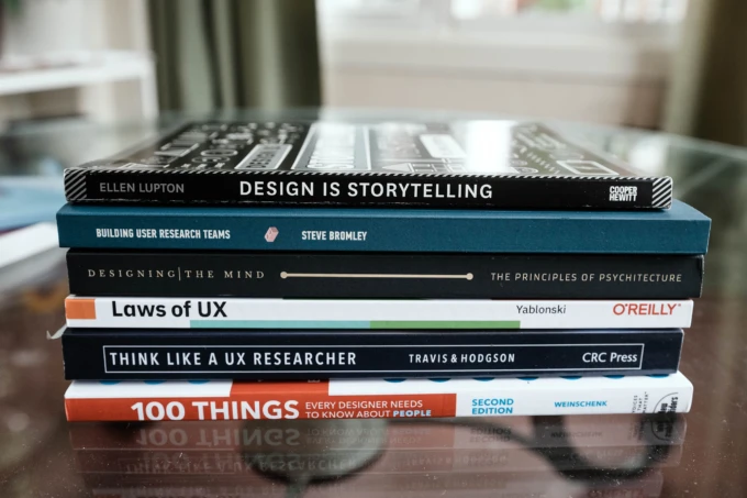 Photo of a stack of books on User Experience