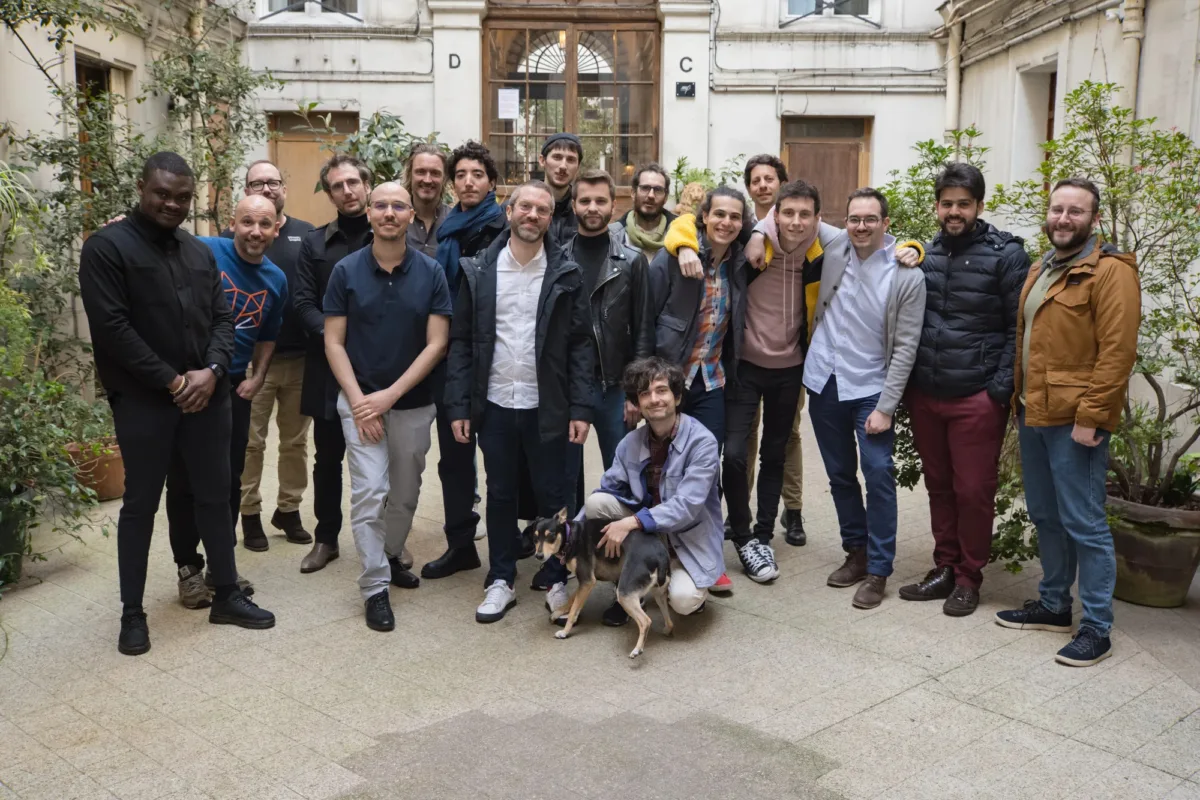 Besedo team outside the entrance of the Paris office