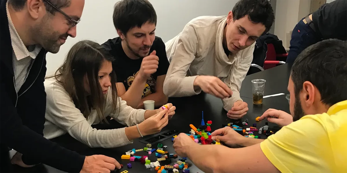 Team members of the Besedo Paris office building legos