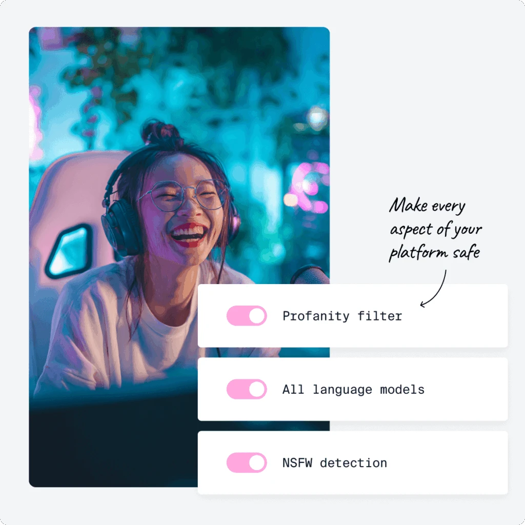 Photo of a laughing woman behind a gaming screen 